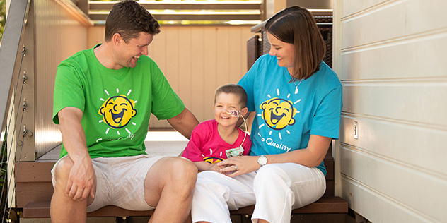 A family wearing Camp Quality tshirts