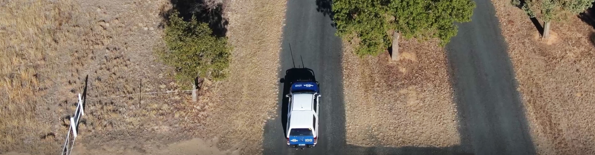 an NRMA car driving along a country road