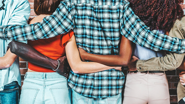 The backs of people hugging