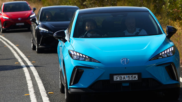 Three MG MG4s on the road