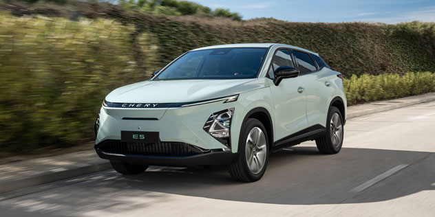 White Chery E5 driving on country road