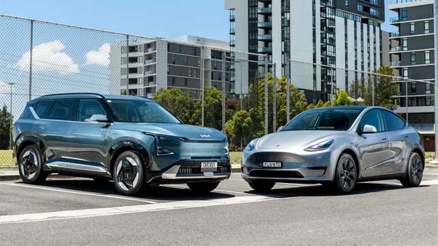 Tesla Model Y and Kia EV5 parked in apartment carpark