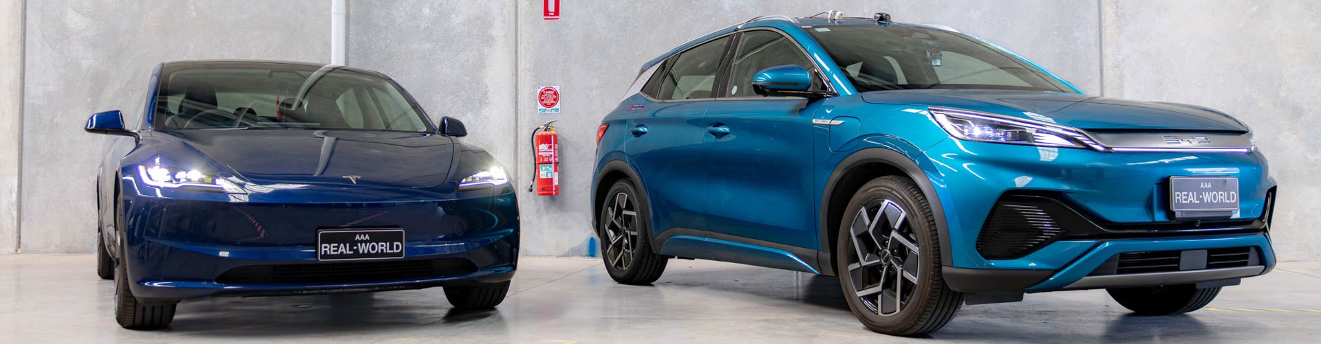 A blue Tesla Model 3 and a turquoise BYD Atto 3