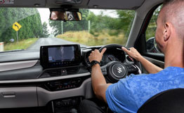 Car journo driving a car