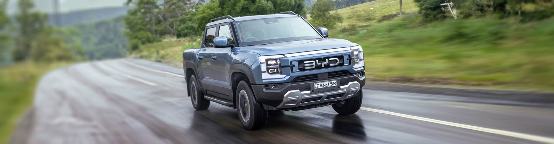 BYD Shark PHEV ute driving on country road