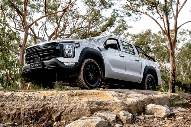 White Foton Tunland V7 parked on rocky outcrop in bushland