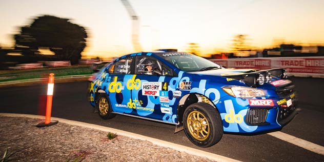 Molly Taylor on the track in a blue Subaru