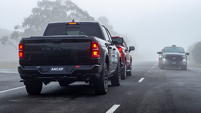 A Ram 1500 pickup truck in fog.