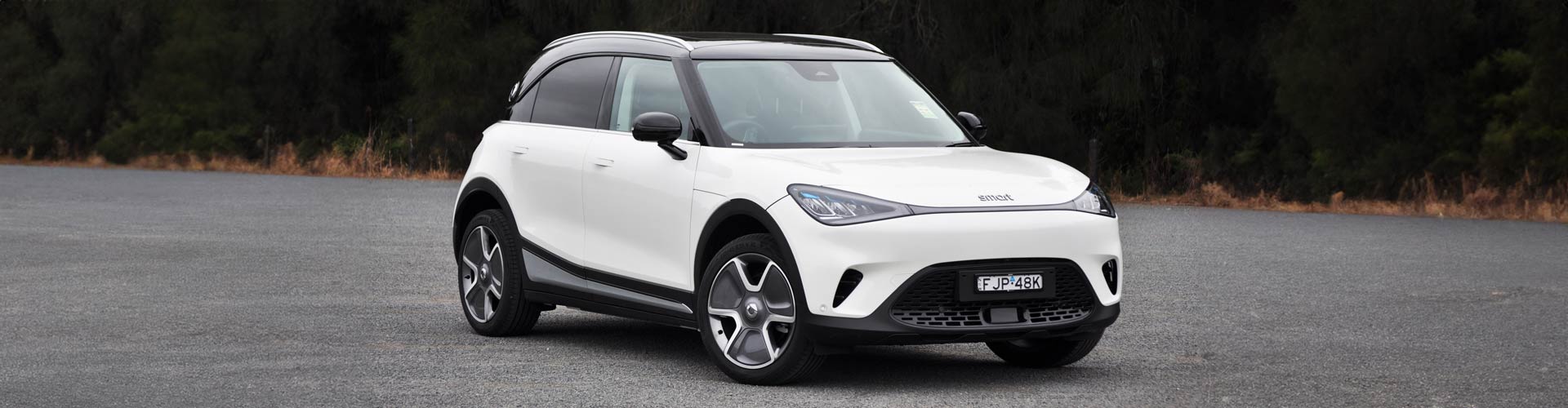 A white 2025 Smart #1 Pro electric car viewed from the front