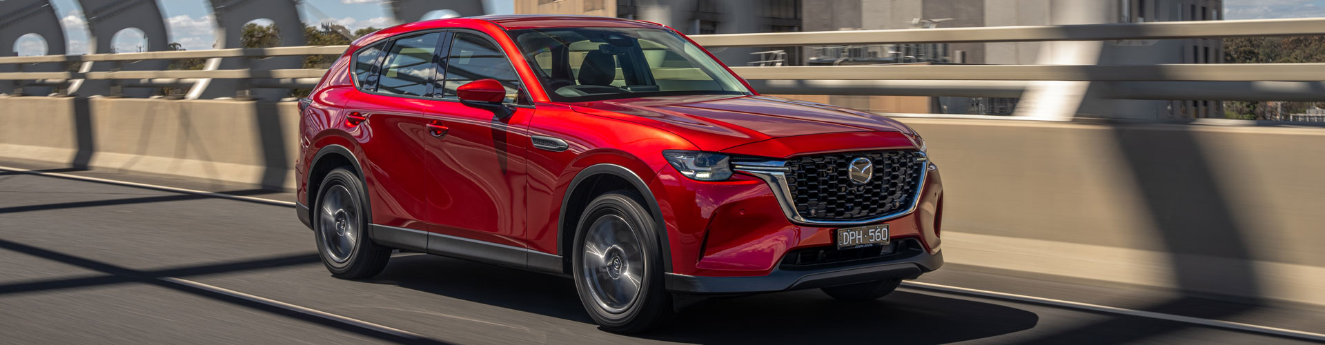 Mazda CX-60 driving on bridge