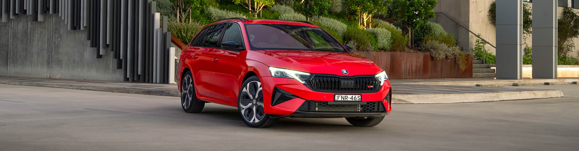 Wide angle shot of a red Skoda Octavia RS wagon