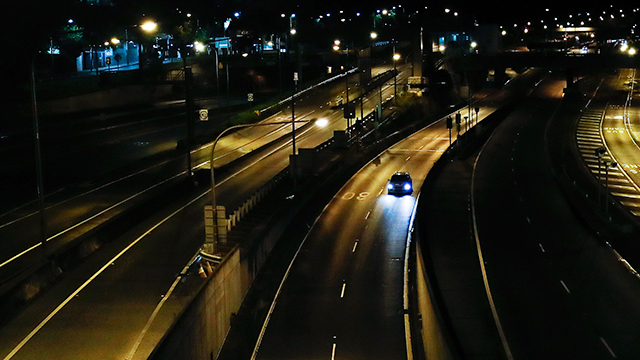 Car on empty highway at night