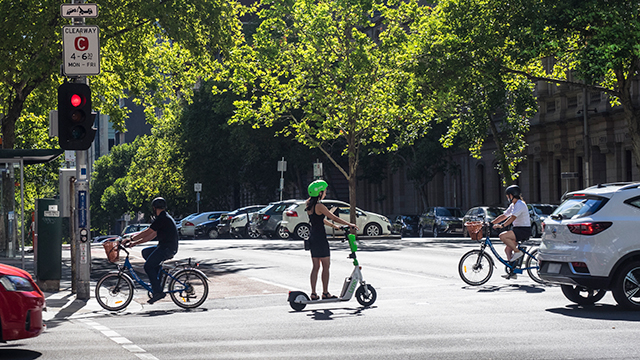 Crossing an intersection on an e-scooter.