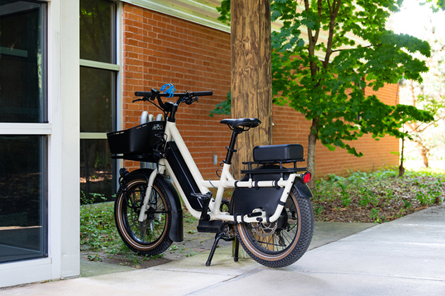 Many people ride an e-bike to work.