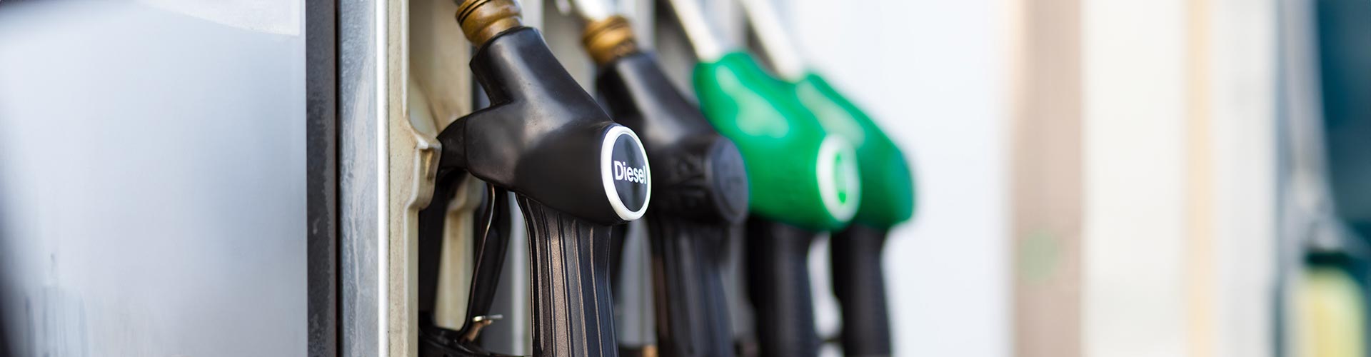 Closeup of fuel bowsers with diesel bowser in focus