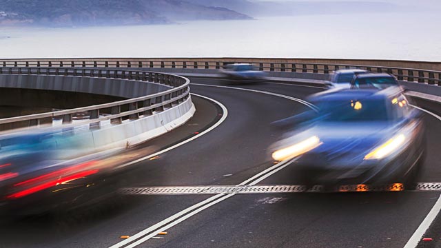 Long exposure of cars with headlights on driving on the seacliff bridge