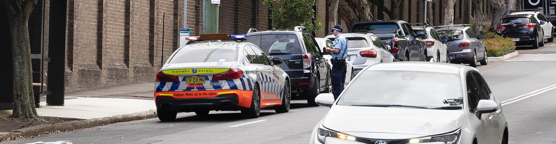 Police officer checking drivers licence
