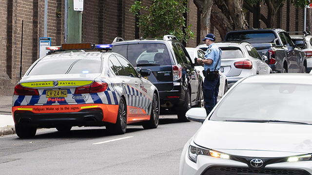 Police officer checking drivers licence