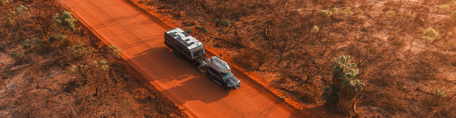 Towing across a red sand road