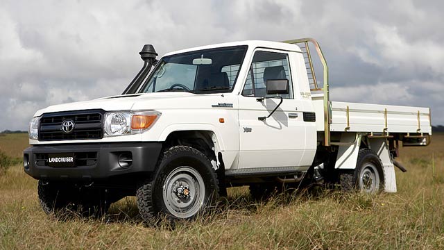 White 2007 Toyota LandCruiser 70 parked in a field