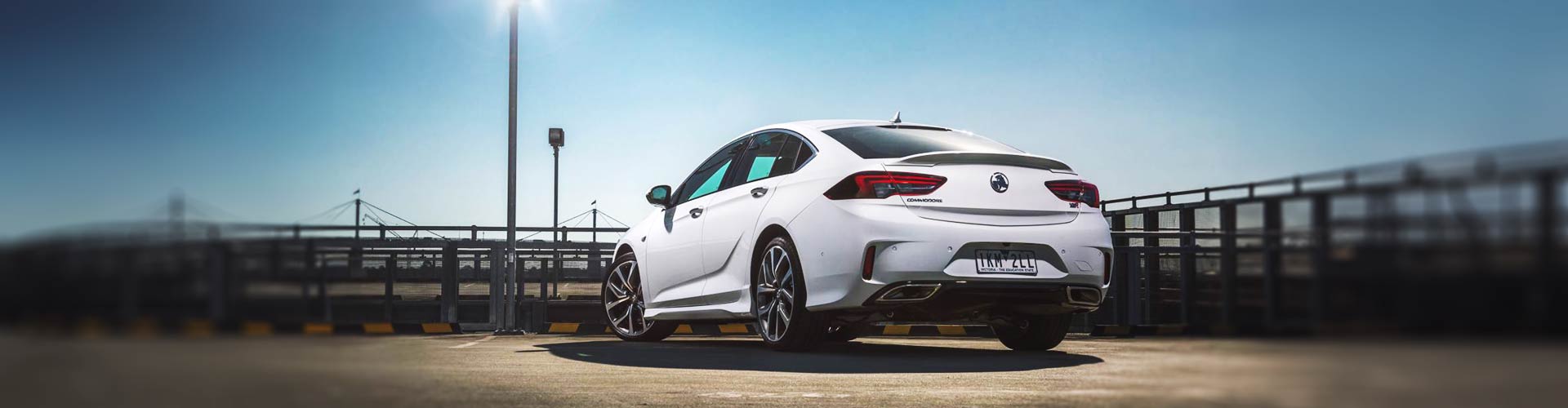 White 2018 Holden Commodore parked on a rooftop carpark