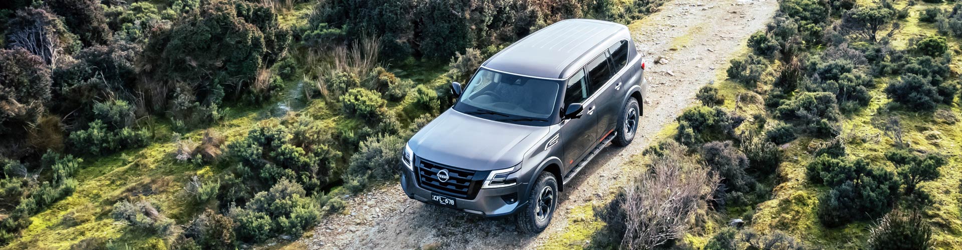 2023 Nissan Patrol Warrior driving on dirt track