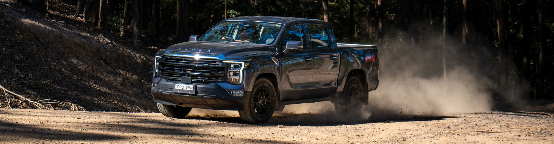 Foton Tunland ute driving on a dirt road