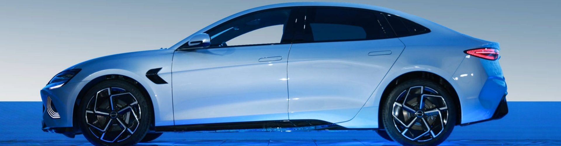 Side view of a blue, 2024 BYD.