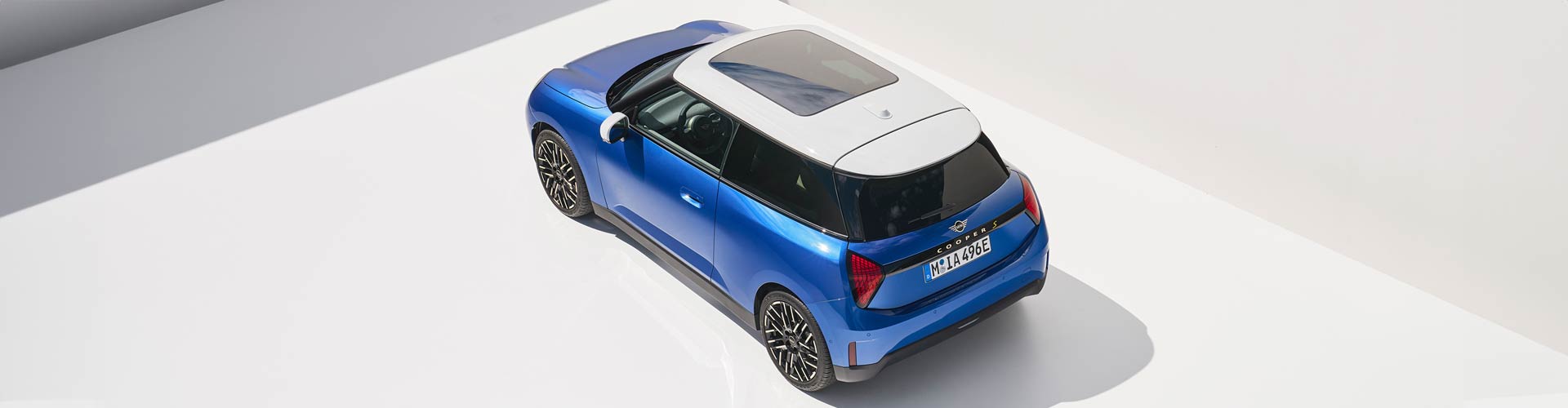 Blue electric 2024 Mini Cooper SE on a white background
