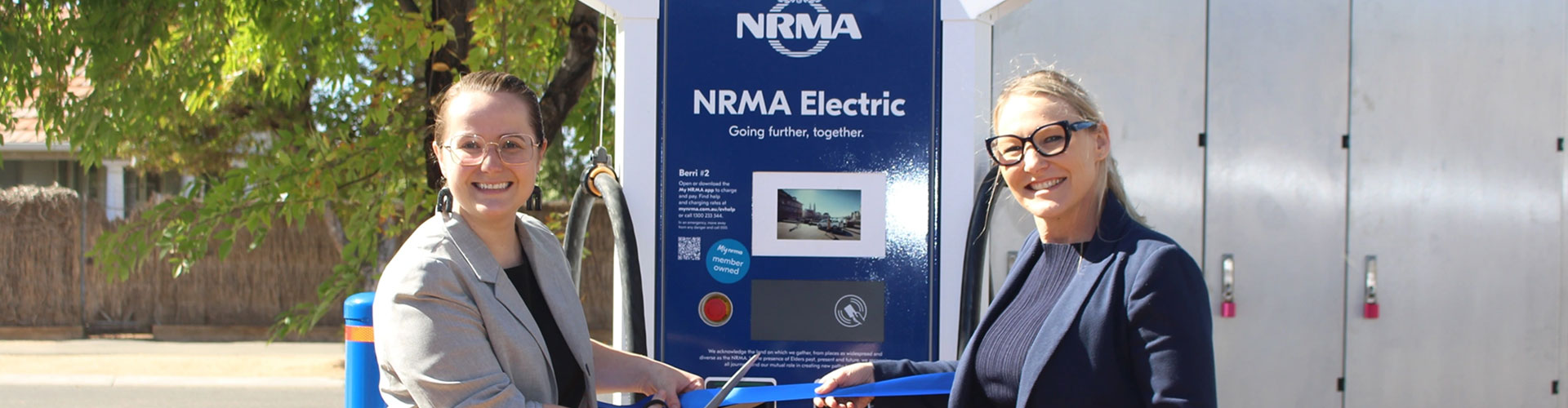 Carly Irving-Dolan and Mayor of Berri Ella Winnall cut a ribbon at an EV charger
