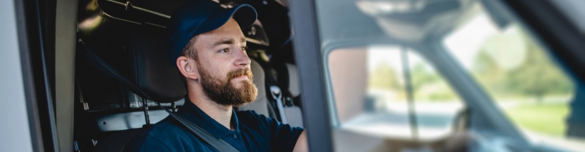 A delivery-van driver behind the wheel