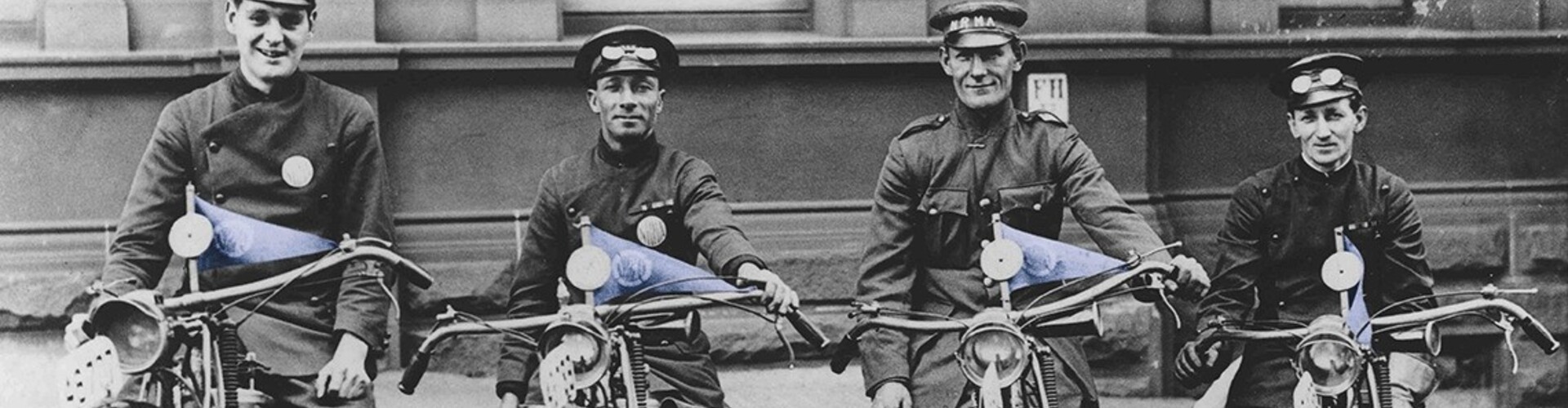 A black and white archival photograph of NRMA first patrols sitting on their motorcycles