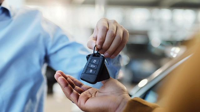 Man handing over keys