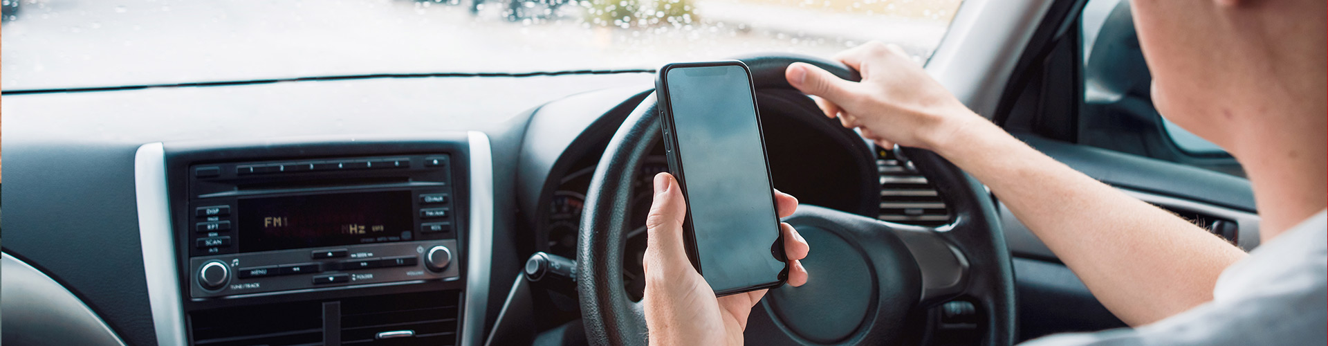 Man using a phone whilst driving