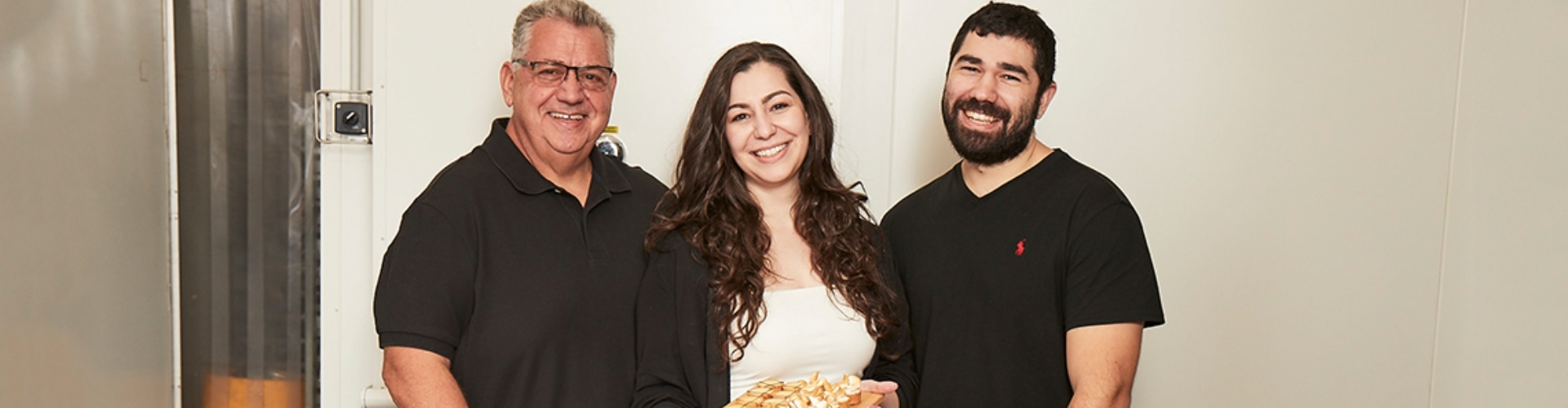 The sister, brother and father team at New York Cakes in their kitchen