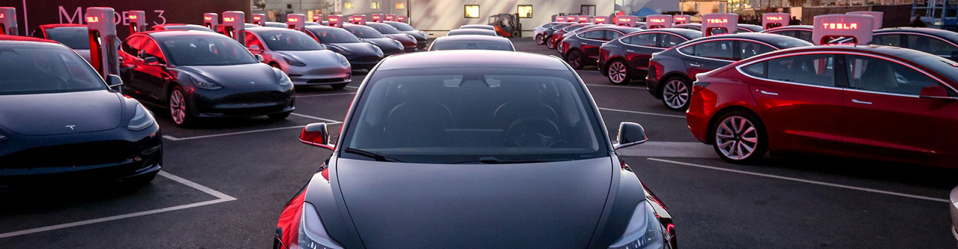 Carpark full of 2017 Tesla Model 3 electric cars