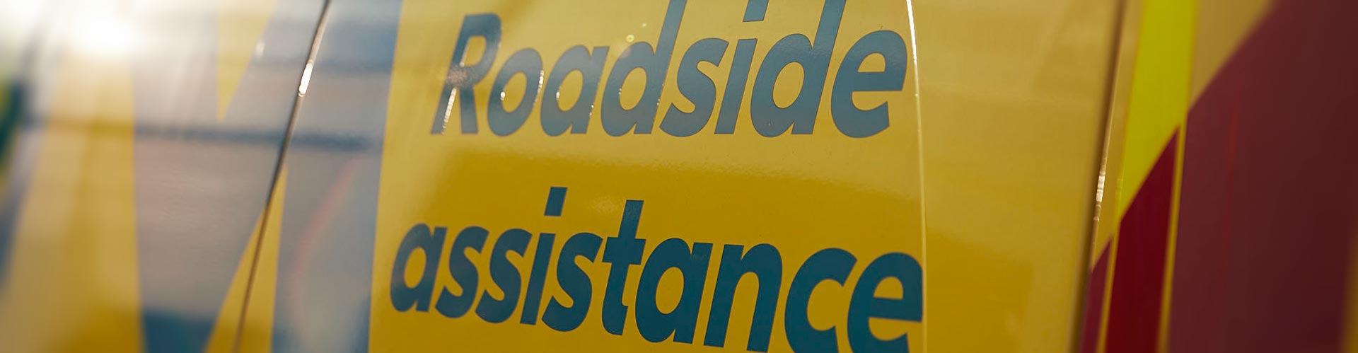 Closeup of roadside assistance sign on NRMA van