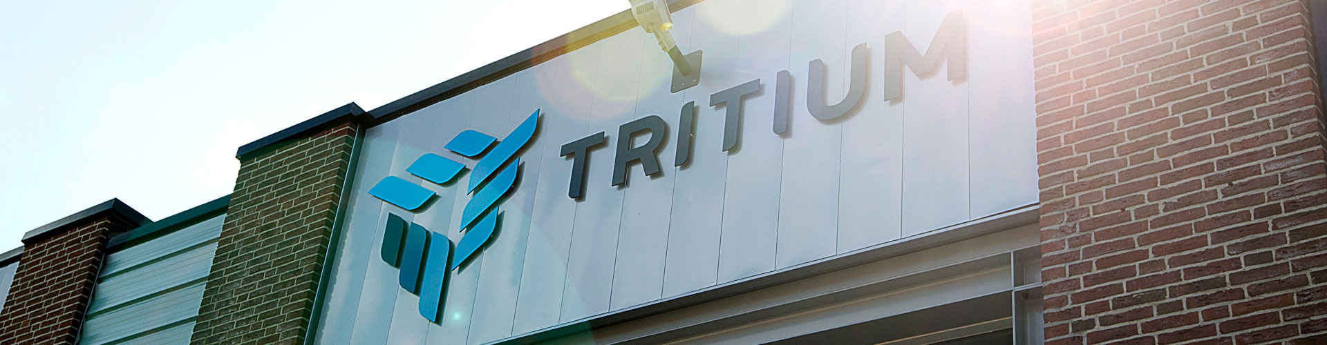 Tritium logo on a brick building