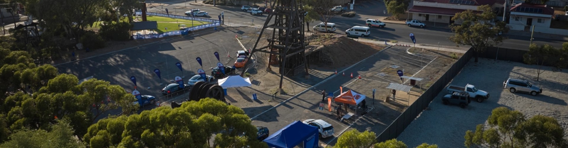 Overhead view of NRMA free EV drive day happening in a Broken Hill outdoor carpark