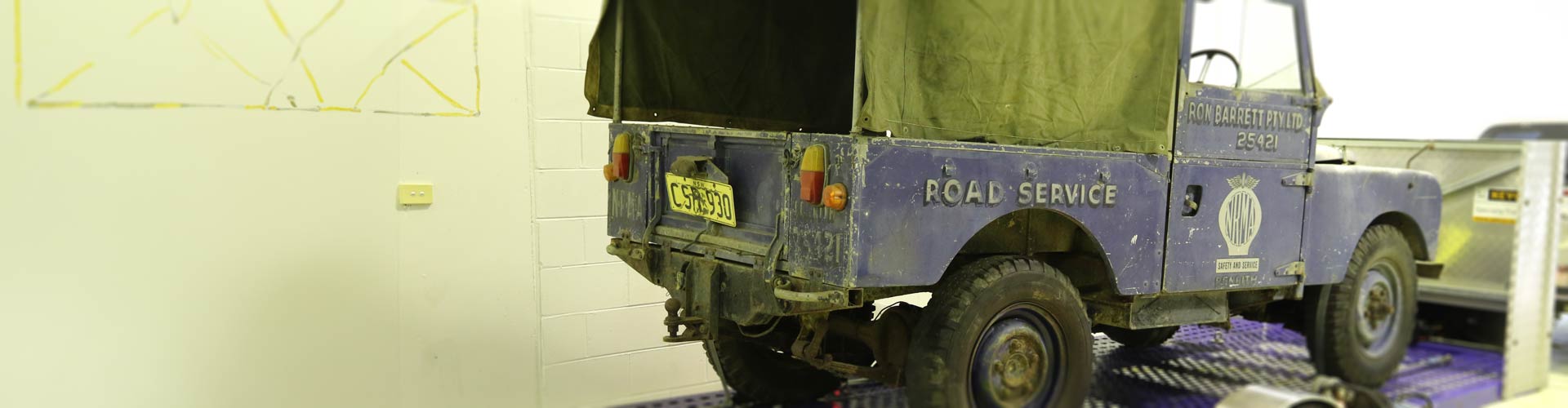 NRMA heritage landrover loaded on a flatbed truck