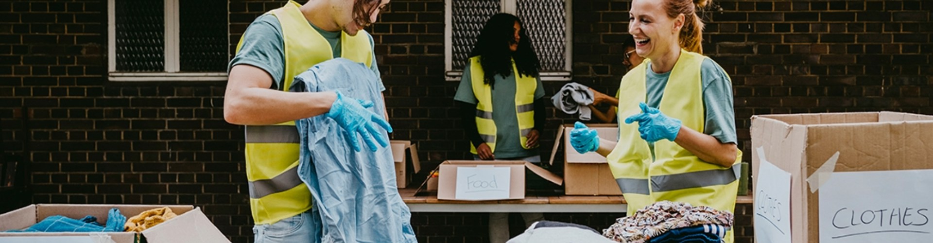 Workers at a GIVIT charity sort clothing