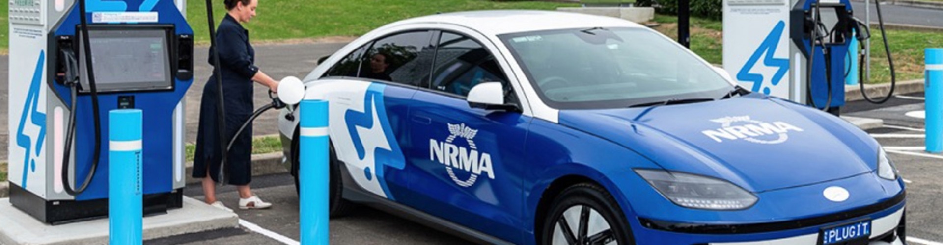 Someone plugging an NRMA charger into their EV