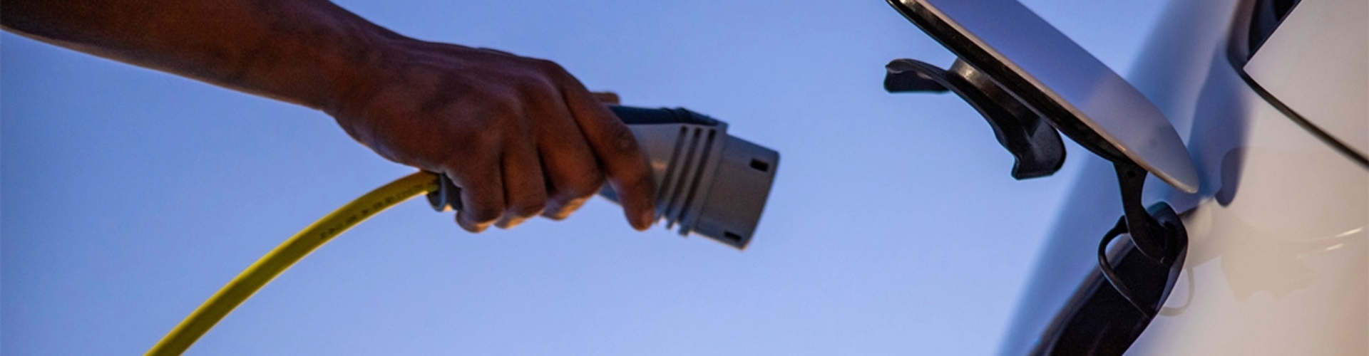 Someone plugging in their EV