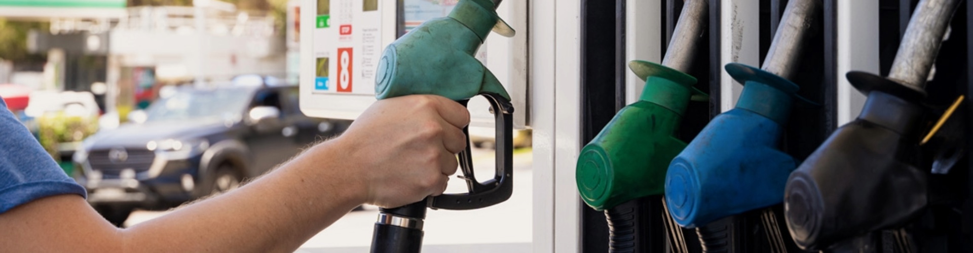 A petrol filler being taken out of the bowser