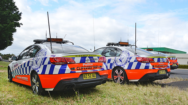 Police cars on the side of the road