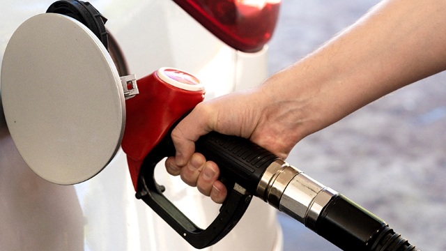 A petrol bowser pump filling a car