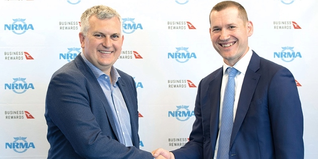Rohan Lund – NRMA Group CEO and Igor Kwiatkowski – Executive Manager Qantas Loyalty shake hands