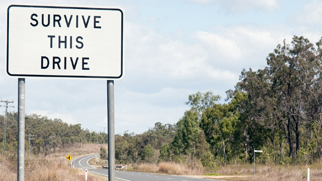 Road sign in rural Australia that reads 'Survive this drive'