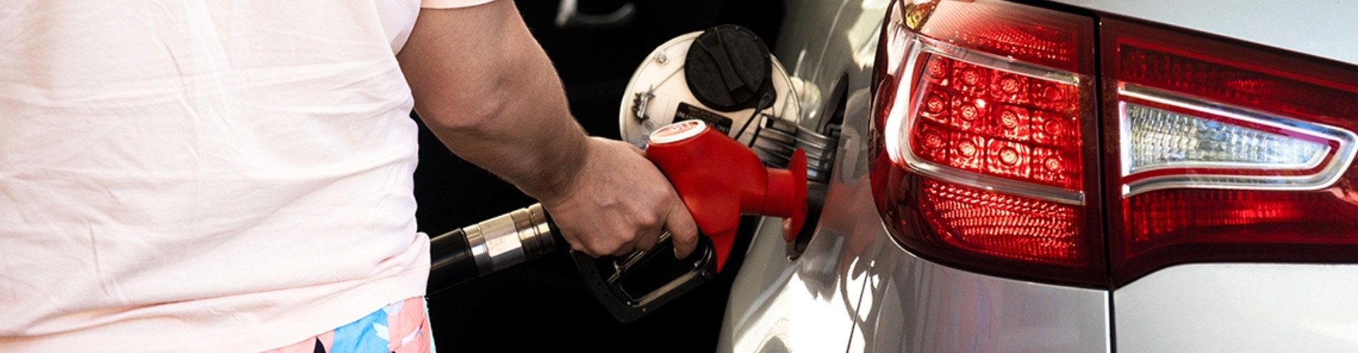 A driver refuels their vehicle