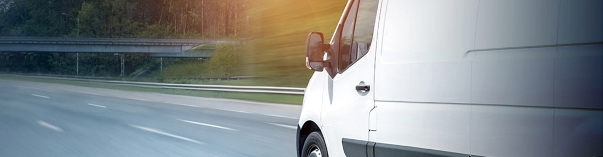 A commercial van on a roadway